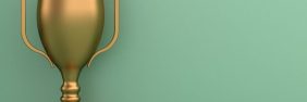 Yellow trophy against a mint green backdrop
