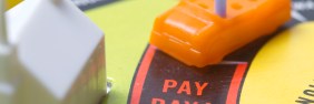 Gamepiece car from the game of Life approaching Pay Day