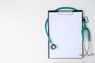 Clipboard with turquoise stethoscope