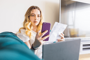 Woman calculating monthly loan payment