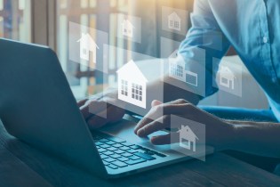 real estate prospecting. Real Estate agent searching for potential clients in computer