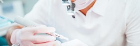 Dentist examining patient's mouth | Real Dental Board Complaint Example