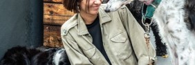 Woman walking dogs as her small business | Small business general liability insurance cost