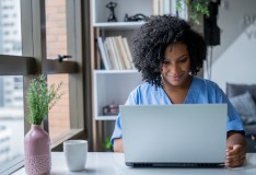 female nurse searching researching types of malpractice insurance for nurse practitioners