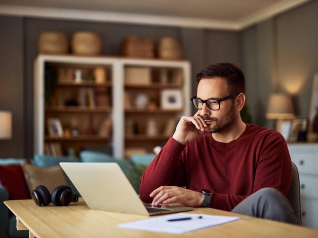 man on laptop search for how much general liability insurance he needs