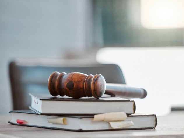 Gavel resting on books about real medical malpractice lawsuits