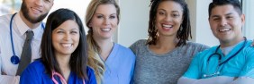 male and female healthcare professionals smiling for a picture | switching liability insurance providers