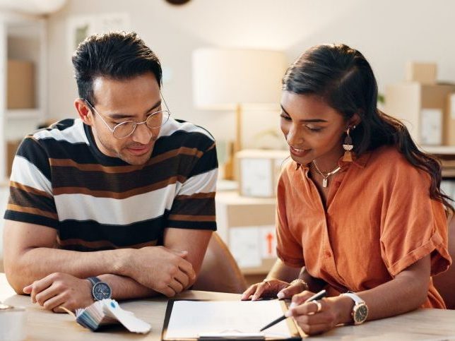 man-and-woman-looking-at-clipboard