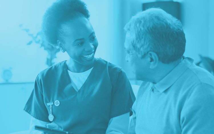 a nurse looking at a computer searching for the best nursing malpractice insurance