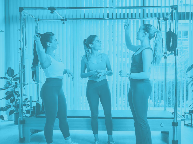 Female Pilates instructor with her students | liability insurance for pilates instructors