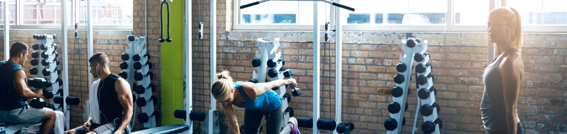women and men working out at gym | gym liability insurance