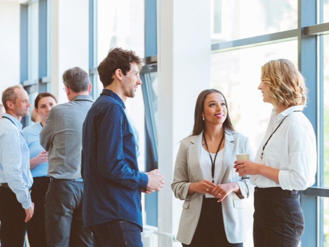 Group of nurses talking together at a nursing conference 