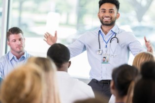 man peaking at a nursing conference in 2026 | best nursing conferences 2026