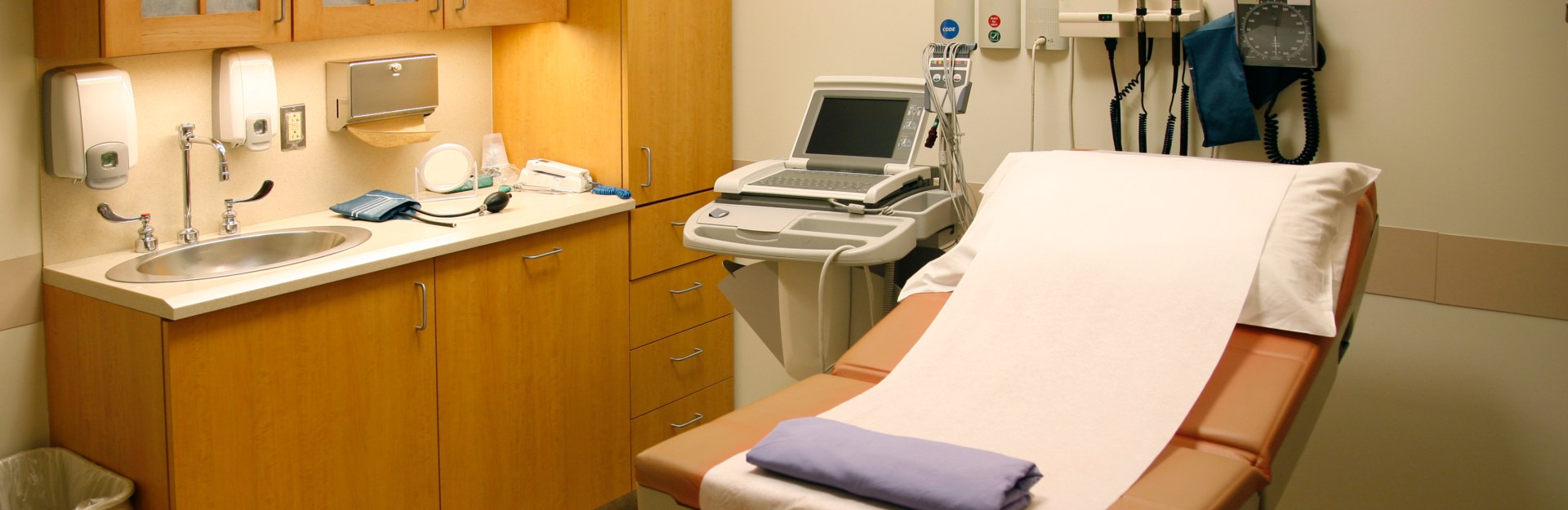 medical exam table in a medical office | medical office insurance