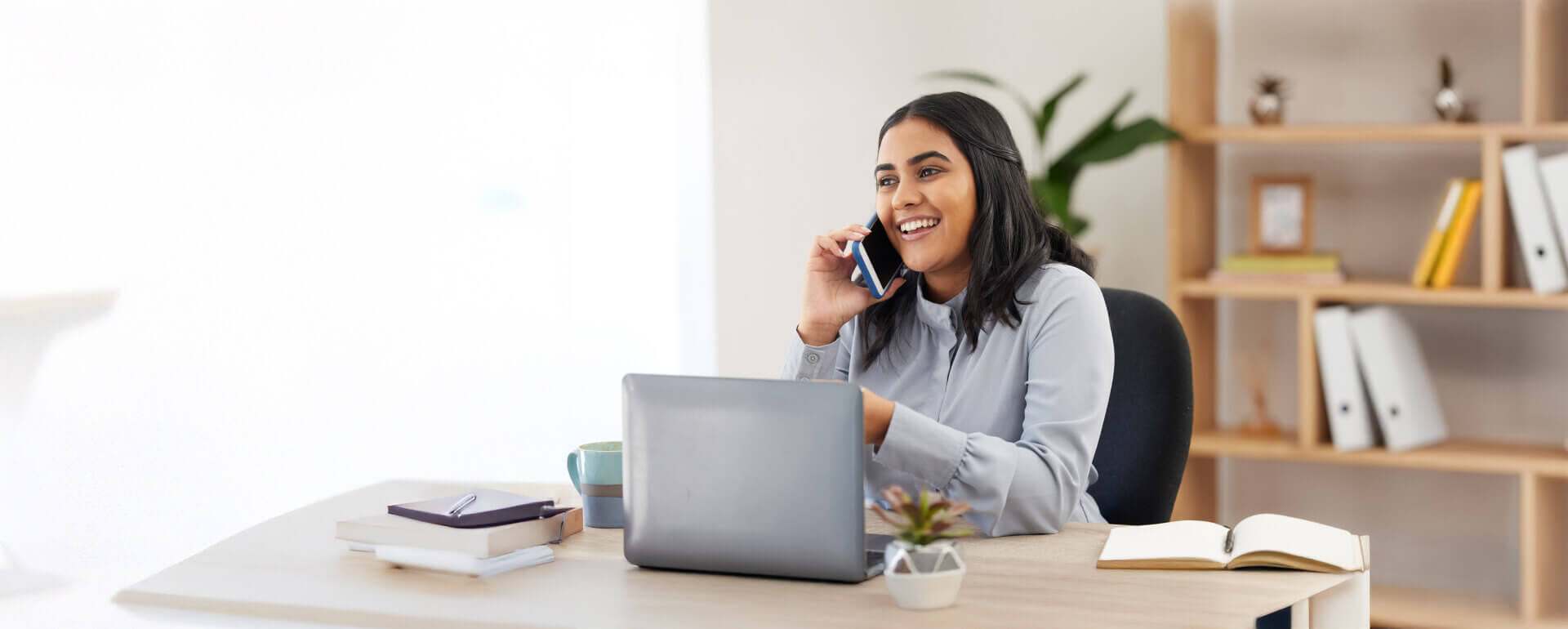 Tax preparer talking on the phone with a client