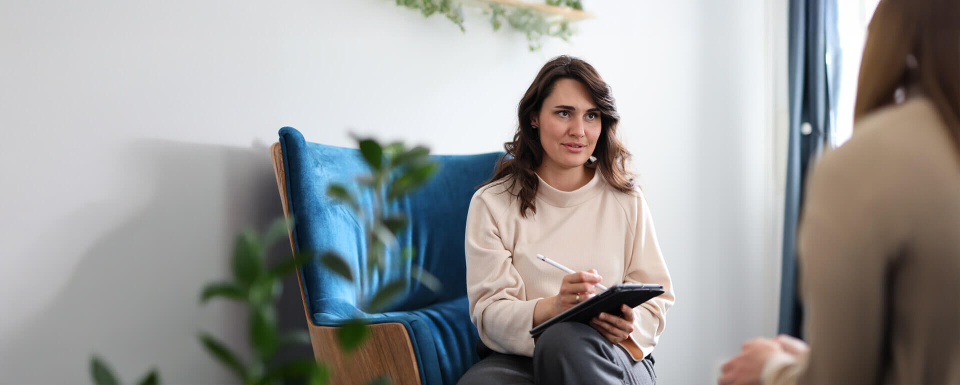 therapist working with client in therapist office | therapist liability insurance