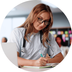 Nursing student taking notes in class 