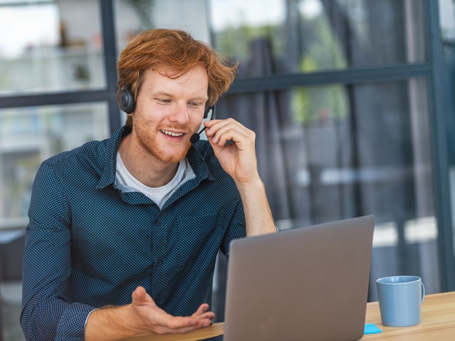 Claims specialist on the phone with a customer
