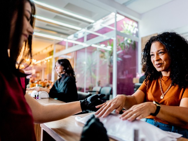 Nail salon professional working on a client's nails