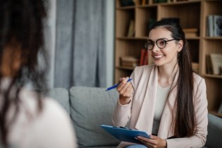 Female counselor with client in her practice | How to get general liability insurance for small businesses