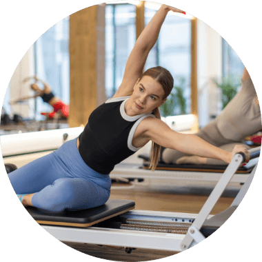 Woman working out in Pilates studio 