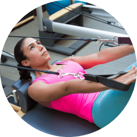 Woman working out on Pilates machine 