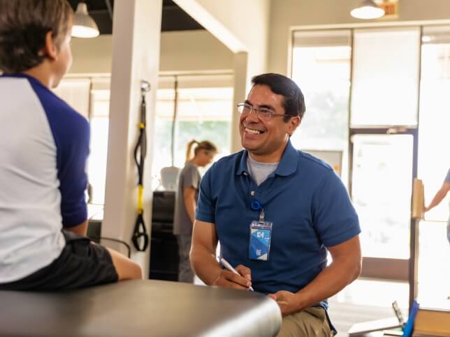 healthcare professional talking with a child patient