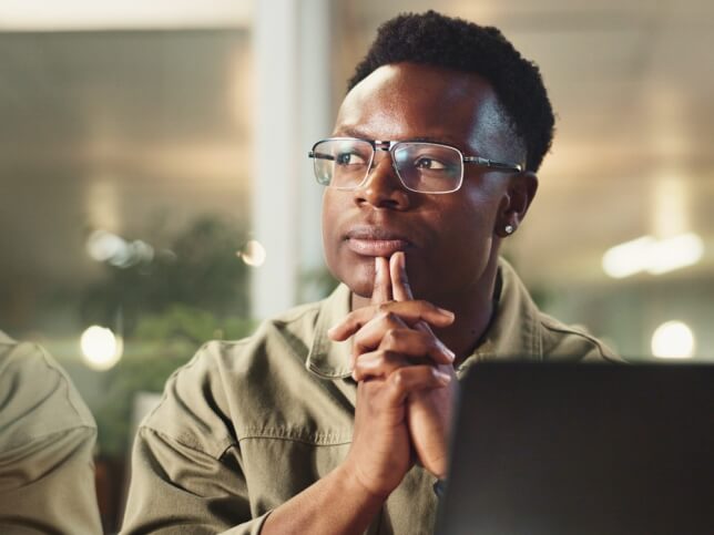 Professional deep in thought while sitting in the office 