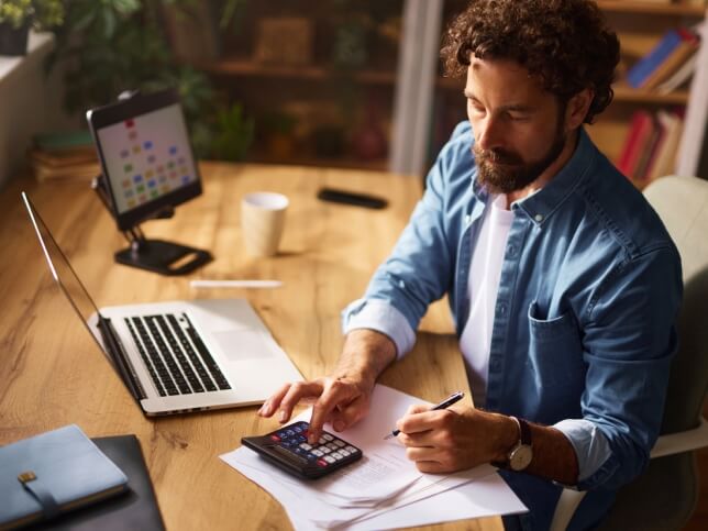 small business owner calculating cost of commercial general liability insurance