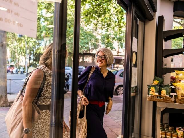 two female shoppers entering a business protected by commercial general liability insurance