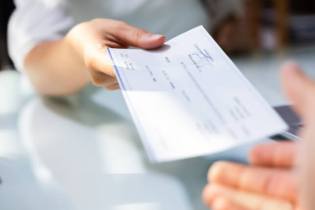 check being paid out for a medical malpractice claim | Who Pays Medical Malpractice Insurance Claims?