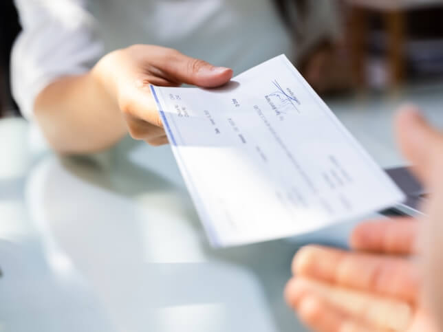 check being paid out for a medical malpractice claim | Who Pays Medical Malpractice Insurance Claims?