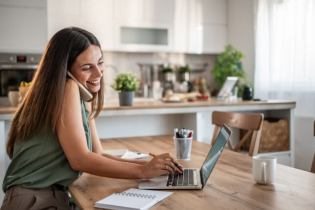small business owner on the phone buying insurance | general liability insurance for small business