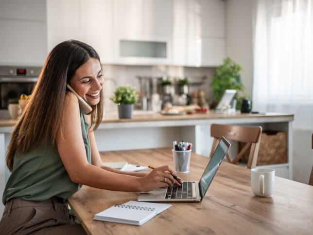 small business owner on the phone buying insurance | general liability insurance for small business
