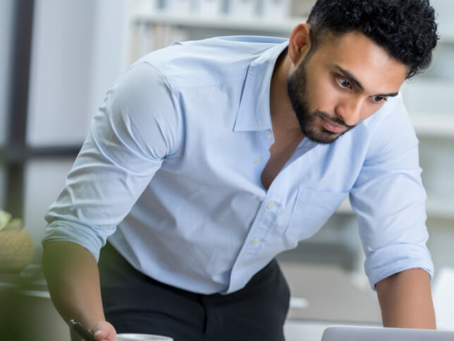 business owner reading through his small business insurance | best insurance for small business owners