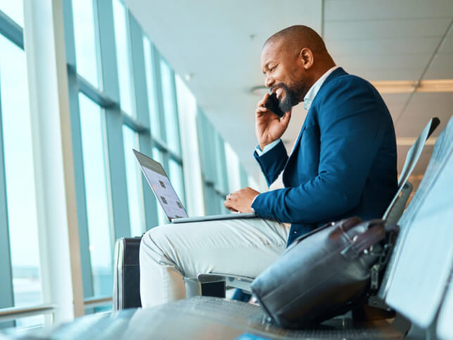Business professional on laptop researching liability insurance | professional liability insurance cost