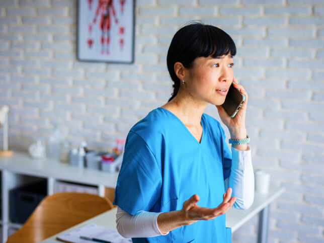 physical therapist on phone with claims team | physical therapist malpractice insurance claim