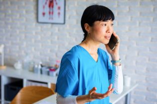 physical therapist on phone with claims team | physical therapist malpractice insurance claim
