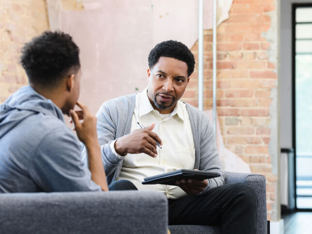 therapist talking one on one with client