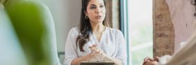 Therapist talking with clients in office | can a therapist be subpoenaed