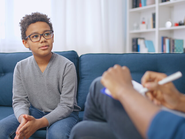 young patient talking with therapist
