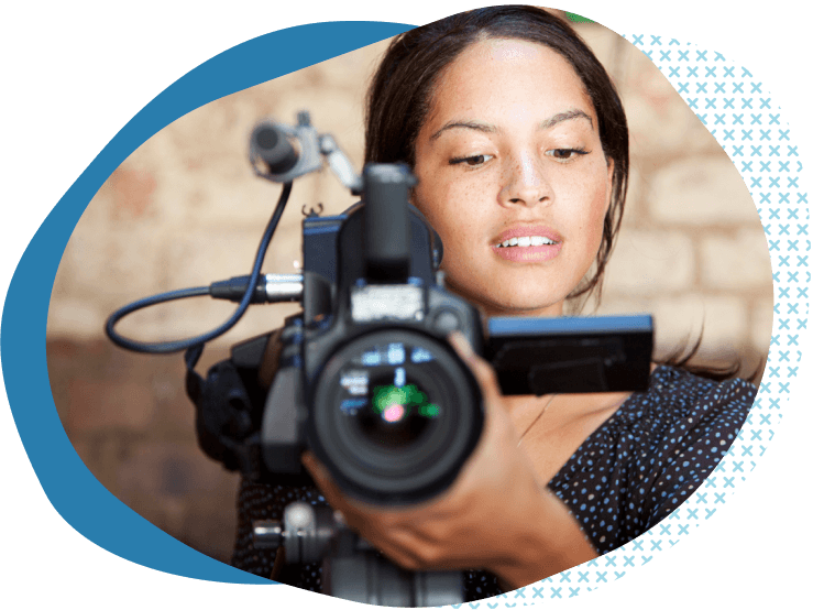 female videographer looking at camera on a photoshoot while learning about videography insurance