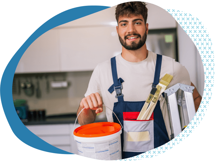 male painter with beard holding painting supplies | painting business insurance